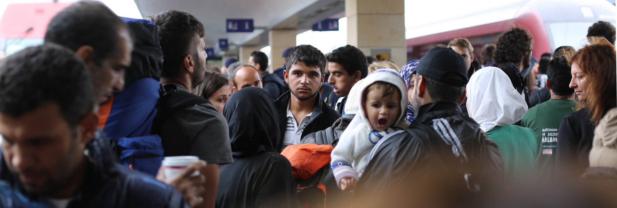 Syrian refugees waiting for a train